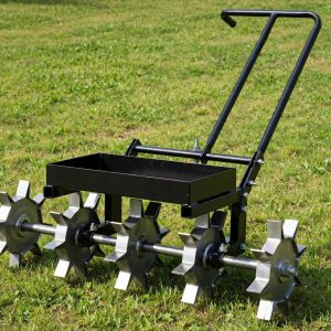 Suchtale 18 inch rolling lawn aerator with five star wheels and weight tray on a large lawn