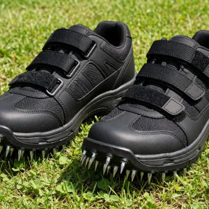 Briliantwerk aerator shoes with spiked soles and adjustable straps on a lawn