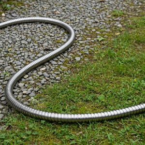 bionic steel garden hose stainless steel metal hose coiled on paving